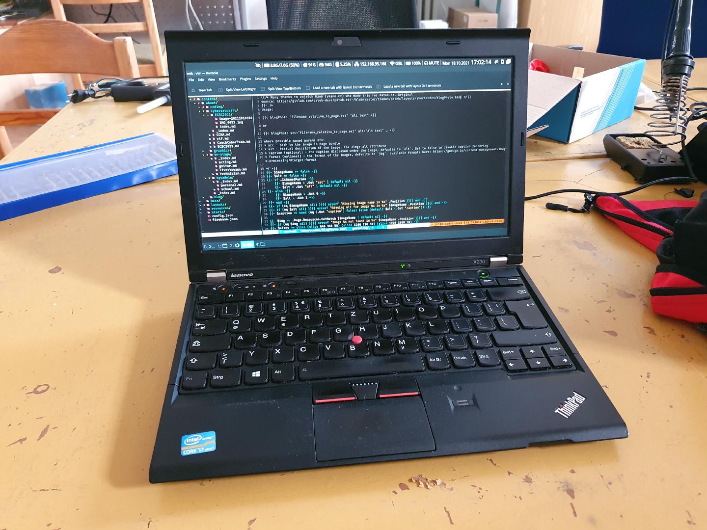 My beloved X230 with the source code for this website open in Vim.